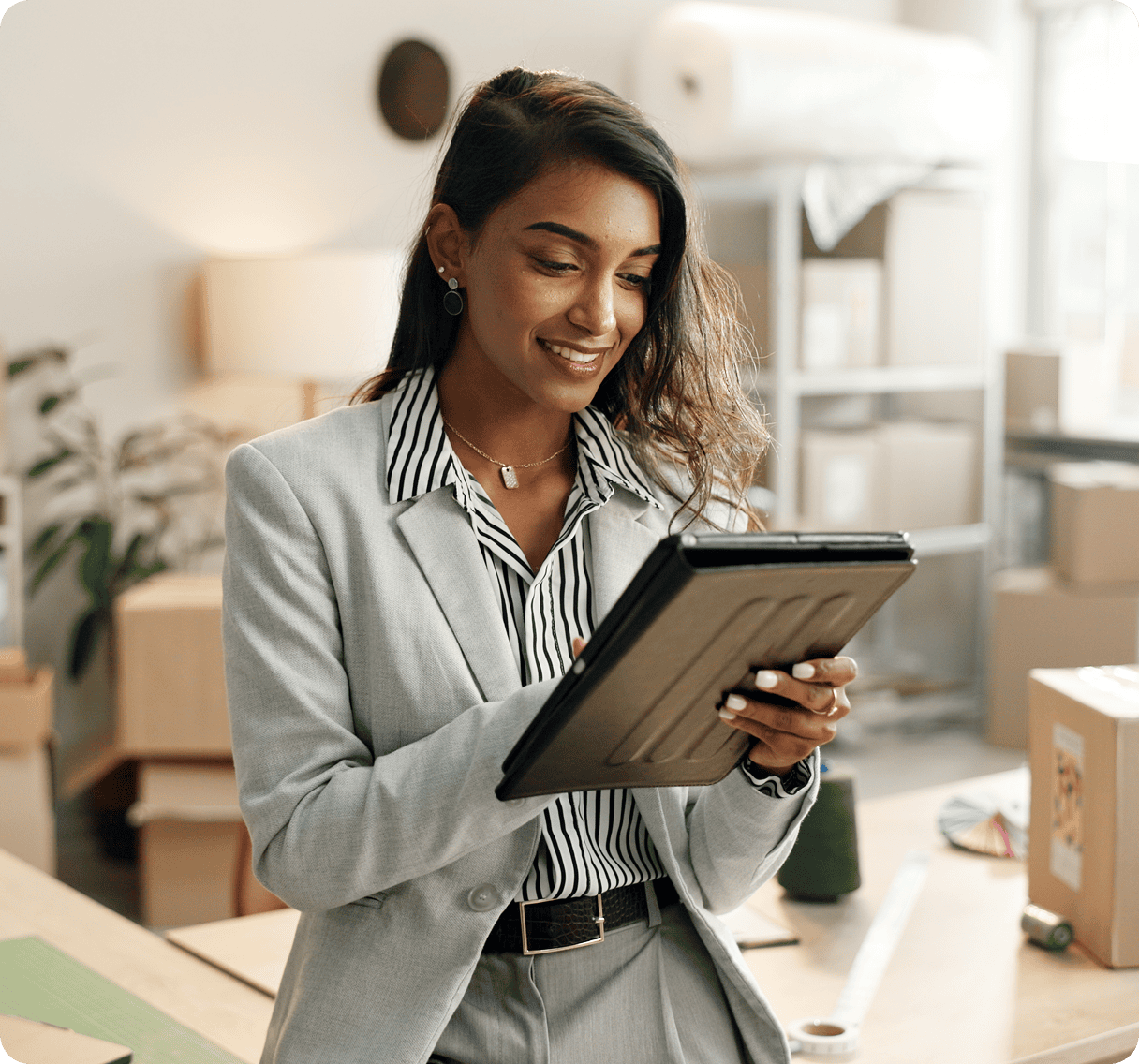 Professional woman smiling with tablet
